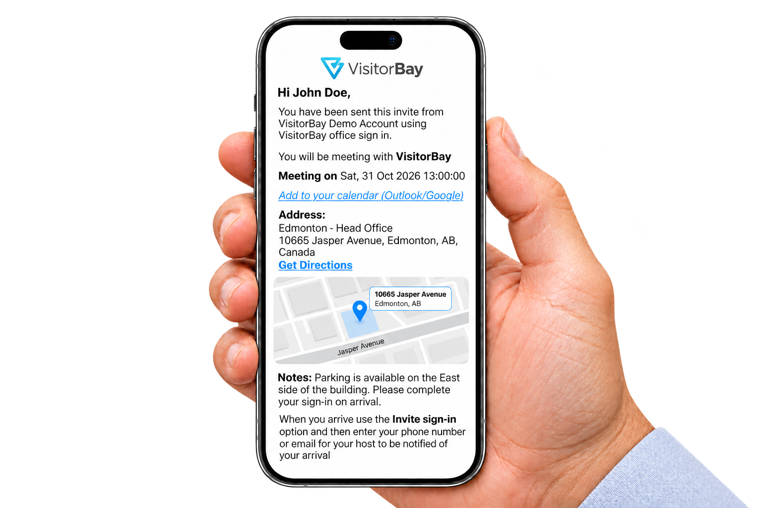 A visitor holding a smartphone displaying a VisitorBay invitation with meeting details, a location map and arrival instructions